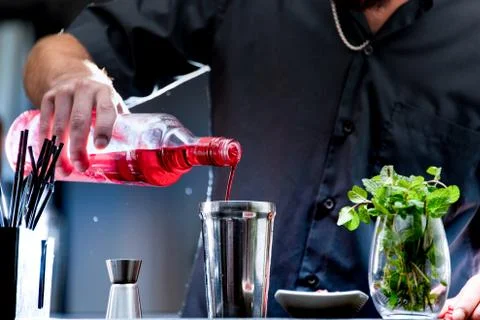 Bartender serving a red cocktail Stock Photos