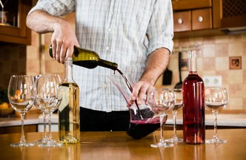 Bartender serving red wine Foto stock