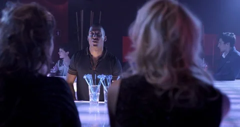Bartender Serving Shots In Busy Disco Bar To People Cheering Stock Footage 91132461