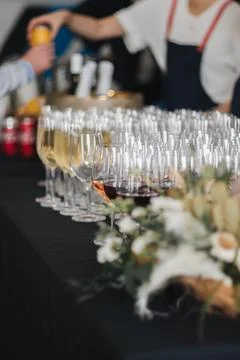 Bartender serving wine, beer and alcoholic beverages at event function Stock Photos