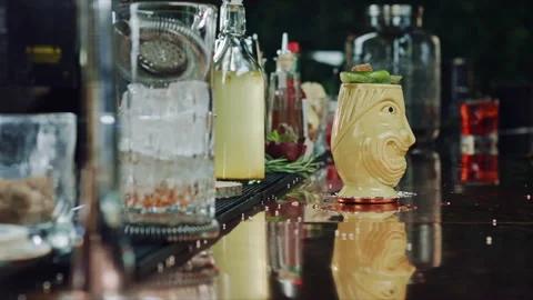 The bartender sets the cocktail on fire Stock Footage 92298912