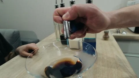 Bartender sets fire to cocktail, burning cinnamon in alcohol drink Stock Footage 131541012