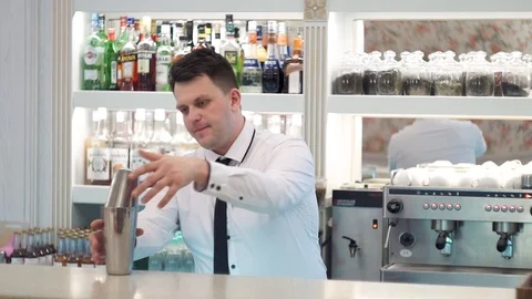 Bartender shakes shaker Stock Footage 101968817