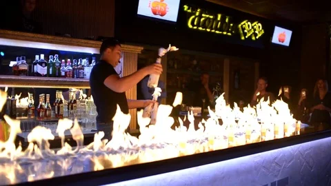 Bartender show performance with fire juggling and alcohol Stock Footage 73225984