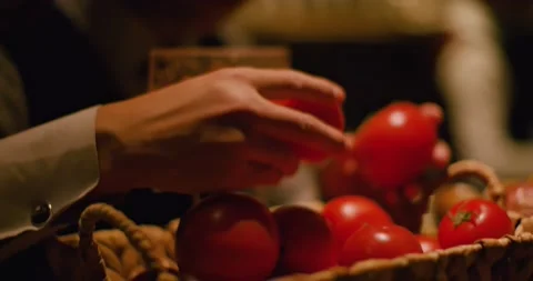 Bartender Sorting and collecting Tomatoes for Cocktail mix Stock Footage 143836892