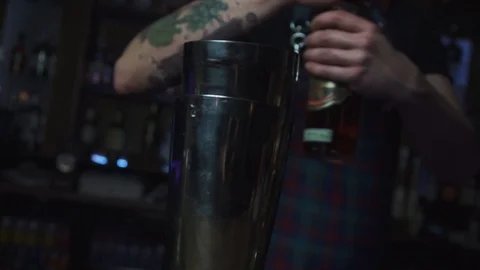 Bartender spinning alcohol bottle Stock Footage 90122920