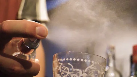 Bartender spraying absinthe on drink - Slow motion Stock Footage 89289771