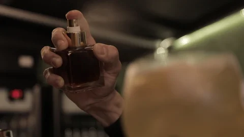Bartender Spraying Aromatic Essence on Gin Cocktail Stock Footage 129780651