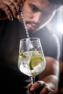 Bartender is stirring cocktail Stock Photos