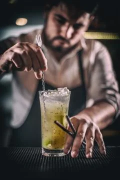 Bartender is stirring cocktail Stock Photos