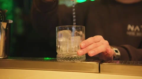 Bartender stirring ice in a glass Stock Footage 309952185