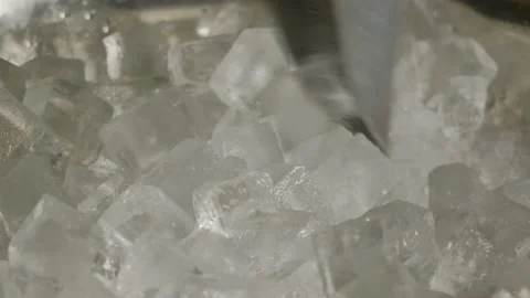 The bartender is stirring with a spatula and taking ice from the ice bucket Stock Footage 185024138