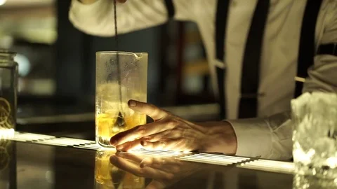 The bartender stirs alcoholic cocktail Stock Footage 71493898
