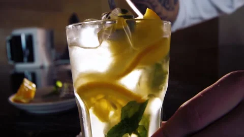 Bartender stirs a cocktail of lemonade Stock Footage 150116418
