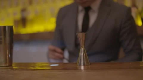 Bartender in Suit Mixing Drinks at Bar Counter in Beijing, China with Tools Stock Footage 345753322