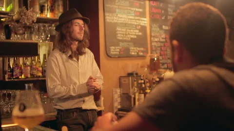 Bartender Talking To Customer At Bar Panning Shot Stock Footage 344538463