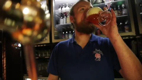 Bartender Tasting Craft Beer Behind Taproom Counter 스톡 동영상 346694812