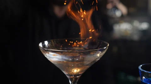 Bartender threw cinnamon powder to flame a cocktail, Flaming Cocktail Alcohol Stock Footage 146188040