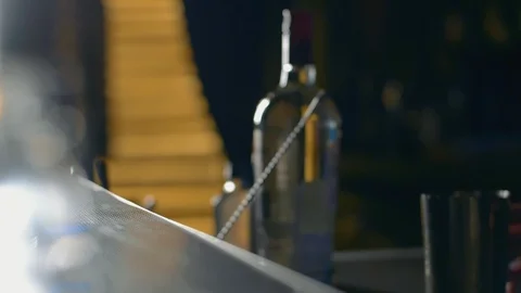 Bartender throw out the ice from shaker Stock Footage 114243400