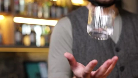The bartender throws up a glass bar Stock Footage 168294817