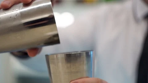 Bartender throws shaker with tomato juice Stock Footage 101966762