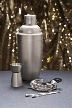 Bartender tools in front of a gold glitter background Stock Photos