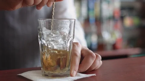 Bartender turns the ice with spoon Stock-Footage 74217325