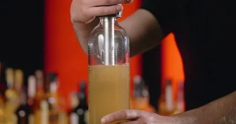Bartender uses a siphon to make a soda lemonade in slow motion, making of the Stock Footage 156600613