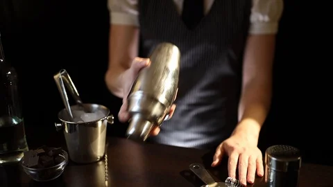 Bartender using cocktail shaker Stock Footage 128739149