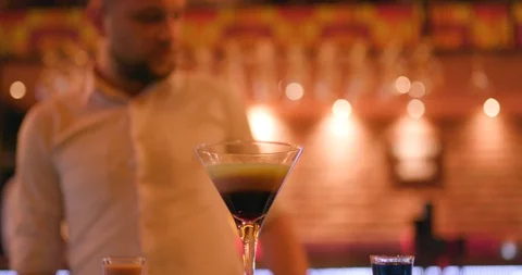 Bartender using lighter to fire up cocktail Stock Footage 106178741