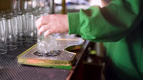 Bartender washes a glass in slow motion Stock Footage 220623092
