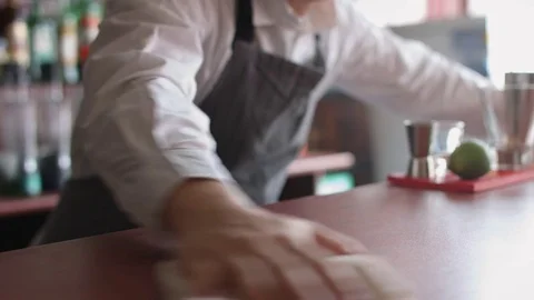 Bartender wipes the counter with rag Stock-Footage 74214449