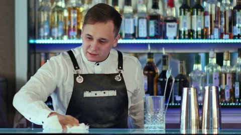 Bartender wiping down bar counter Stock-Footage 76612777