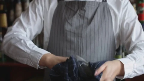 Bartender wiping glass with rag Vídeo Stock 74216843