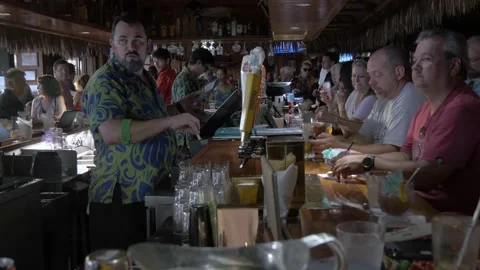 A Bartender Working The Bar At Duke's Waikiki In Honolulu, Hawaii Stock Footage 154293374