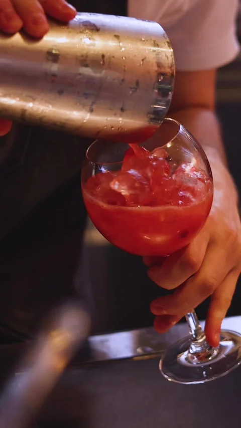 Bartender working, barman mixing alcohol drinks and pouring beverages, bar club Video stock 320800164