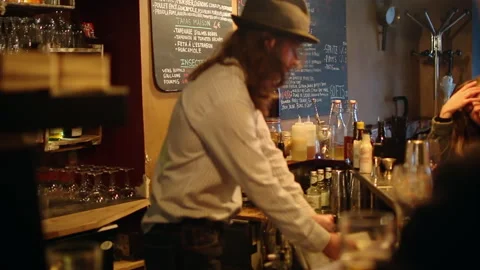 Bartender Working Behind Paris Craft Beer Bar Counter with Insects Menu Stock Footage 346279852