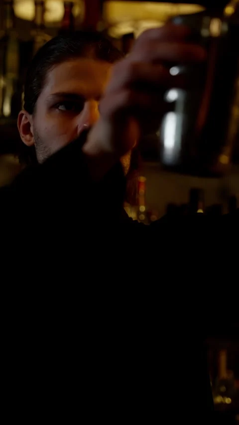 Bartender's Focused Gaze While Crafting Drink Stock Footage 262654117