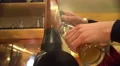 Bartenders hands pouring tasty beer into glass, professional service, brewing 4k or 4k+ Resolution
