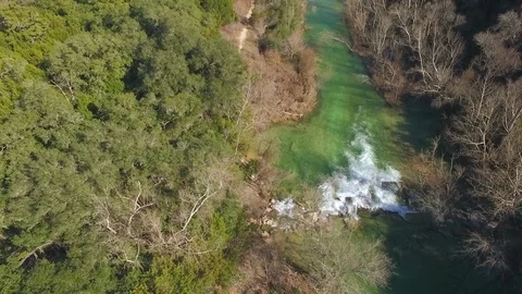 Barton Creek Austin Texas streaming waterfall drone moving right 4k Stock Footage 101309896