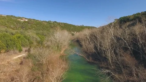Barton Creek Austin Texas streaming waterfall drone moving right 4k Stock Footage 101310169
