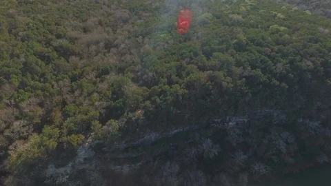Barton Creek Austin Texas streaming waterfall drone moving while panning and til Stock Footage 101311335