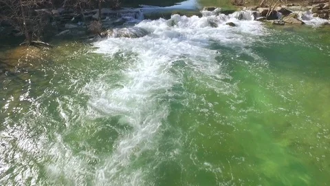 Barton Creek Austin Texas streaming waterfall drone moving up creek up while til Stock Footage 101394280