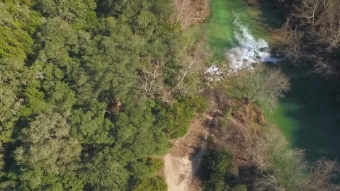 Barton Creek Austin Texas streaming waterfall drone ascending while tilting down Stock Footage 101494145
