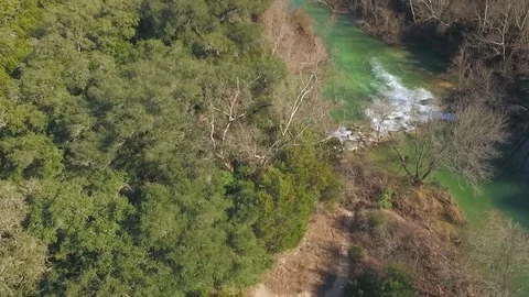 Barton Creek Austin Texas streaming waterfall drone descending while tilting up Stock Footage 101494920