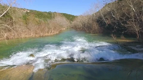 Barton Creek Austin Texas streaming waterfall moving down stream over waterfall Stock Footage 101497528