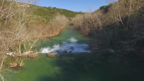 Barton Creek Austin Texas streaming waterfall drone is moving down stream over w Stock Footage 101500503