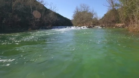 Barton Creek Austin Texas streaming waterfall drone is moving up stream over wat Stock Footage 101501090