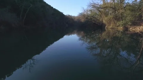 Barton Creek Austin Texas streaming waterfall drone is moving up stream over cre Stock Footage 101668675