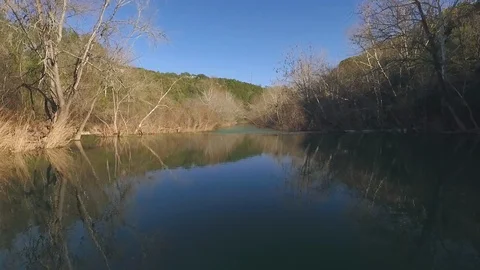 Barton Creek Austin Texas streaming waterfall drone is moving down stream low ov Stock Footage 101668828